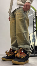 Jeans sabbiato borchie